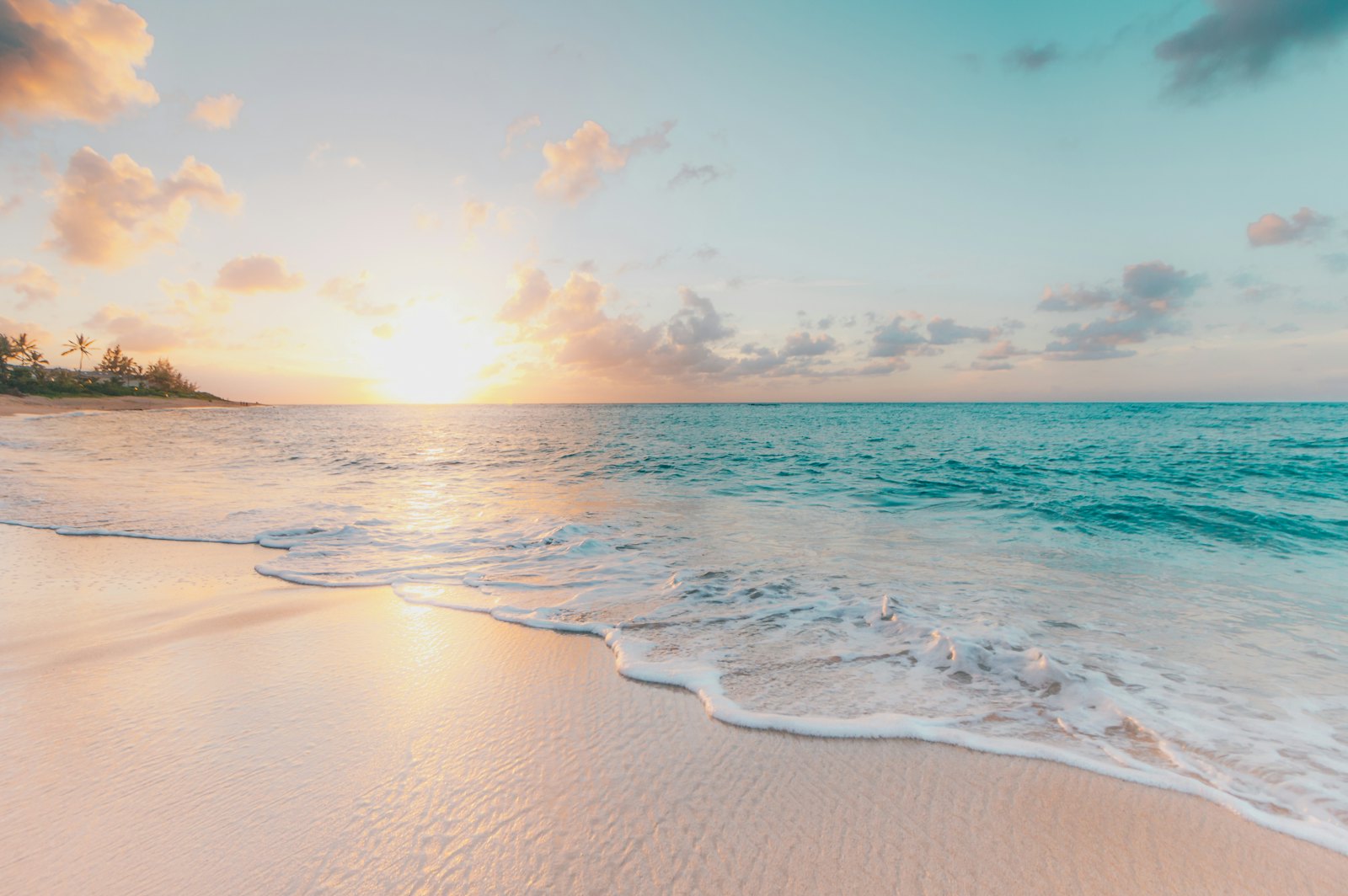 Turquoise tropical beach at sunset